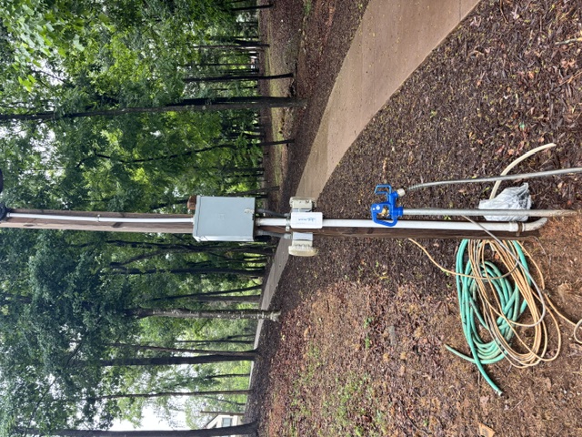 DockaFi mounted on a light post near a dock