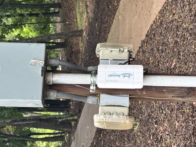 Close-up of DockaFi on a light post showing branding