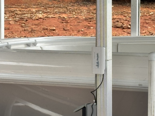DockaFi mounted on a dock railing